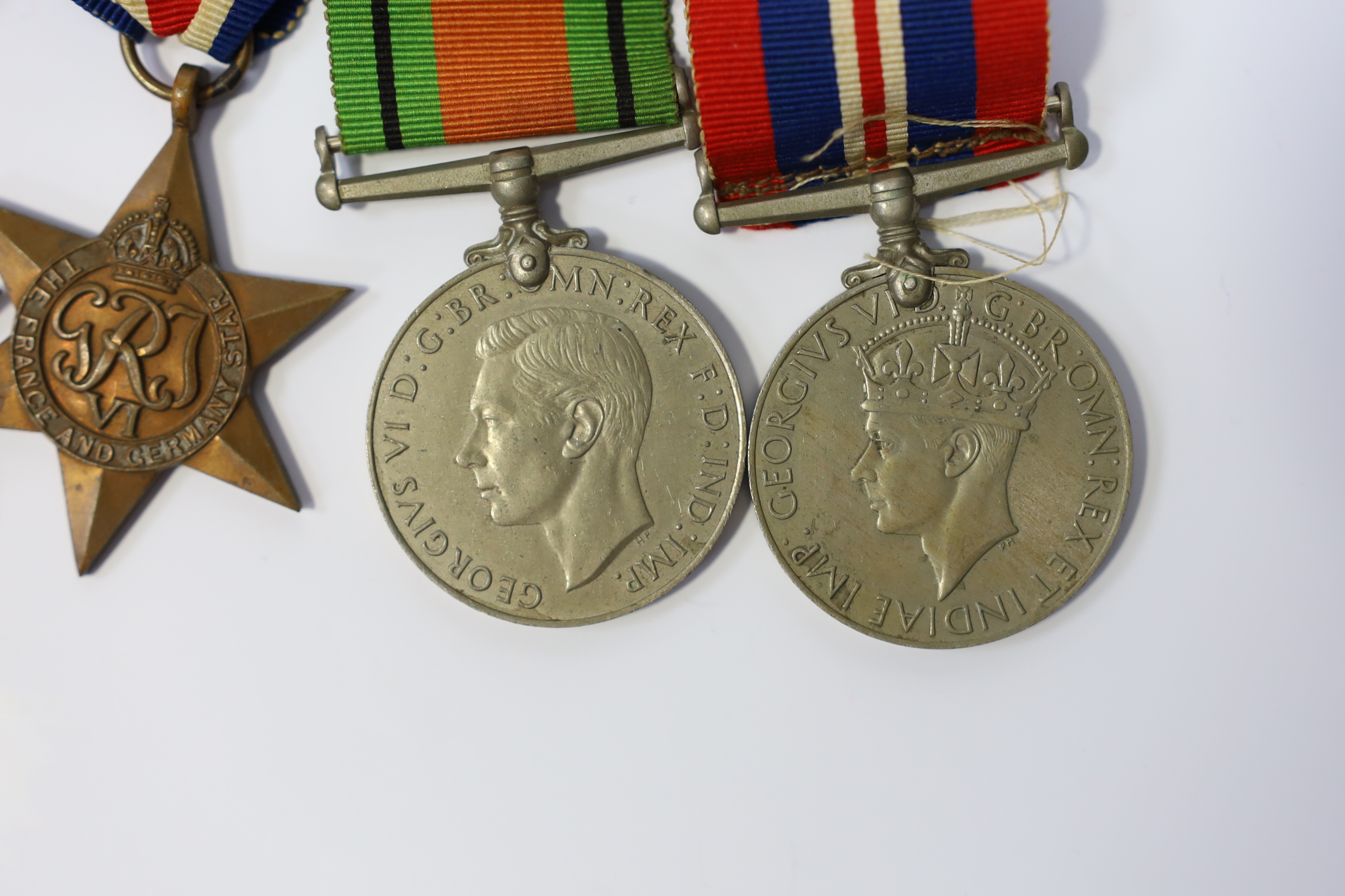 A WWII medal group awarded to Pte. J. Langridge S. Staff, comprising; a General Service Medal with two bars for Palestine and Palestine 1945-48, stamped to the edge with the recipient’s details, together with a 1939-45 S